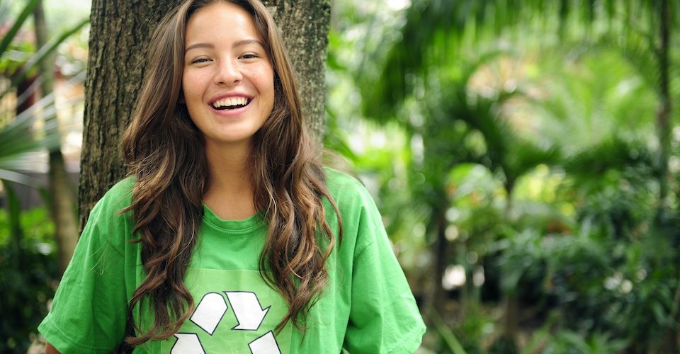 Girl in green recycle logo shirt A\J AlternativesJournal.ca