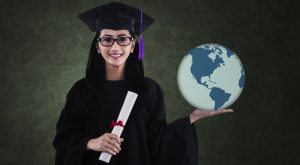 Graduating student holds the planet in her hands.